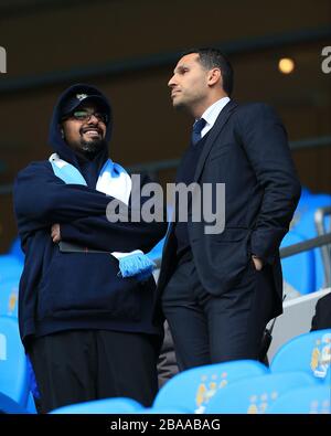 Manchester City chairman Khaldoon Al Mubarak (right) in the stands Stock Photo