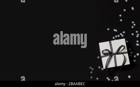 Festive wallpaper or backdrop with white confetti. Stock Photo