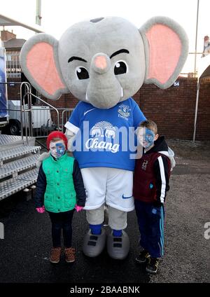 Young Everton fans with Everton mascot Changy the elephant outside Goodison Park before the game. Stock Photo