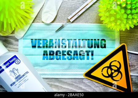 PHOTOMONTAGE, mask with the stroke event called off, biology danger sign, protective gloves, clinical thermometers and disinfectants on a table, symbo Stock Photo
