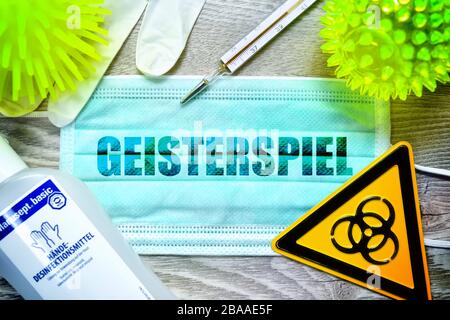 PHOTOMONTAGE, mask with the stroke mind play, biology danger sign, protective gloves, clinical thermometers and disinfectants on a table, symbolic pho Stock Photo