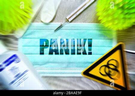 PHOTOMONTAGE, mask with the stroke panic, biology danger sign, protective gloves, clinical thermometers and disinfectants on a table, symbolic photo C Stock Photo