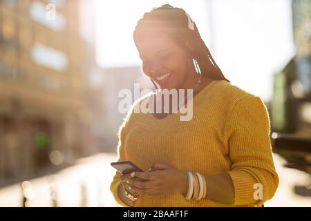 Afro american woman in an urban city area Stock Photo
