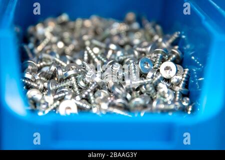 screws in blue box for joining materials Stock Photo