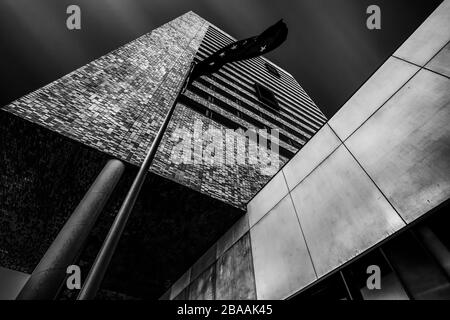 Greyscale low angle shot of a building with cool design Stock Photo