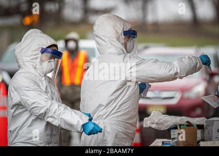 New Jersey Air National Guard medics with the 108th Wing process specimens at a COVID-19 Community-Based Testing Site at the PNC Bank Arts Center March 23, 2020 in Holmdel, New Jersey. Stock Photo