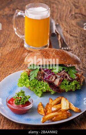 pulled pork in a bun with beer Stock Photo