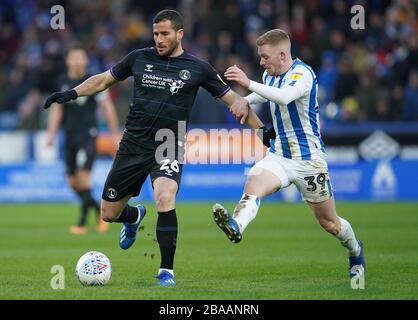 Charlton Athletic's Tomer Hemed, left, and Huddersfield Town's Lewis O'Brien Stock Photo