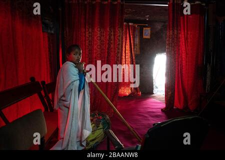 Africa, Ethiopia, Adadi Mariam.  Religious procession in Adadi Mariam. A young devote holds a cane Stock Photo