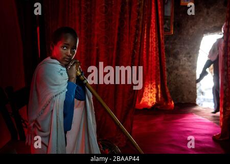 Africa, Ethiopia, Adadi Mariam.  Religious procession in Adadi Mariam. A young devote holds a cane Stock Photo