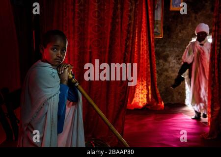 Africa, Ethiopia, Adadi Mariam.  Religious procession in Adadi Mariam. A young devote holds a cane Stock Photo