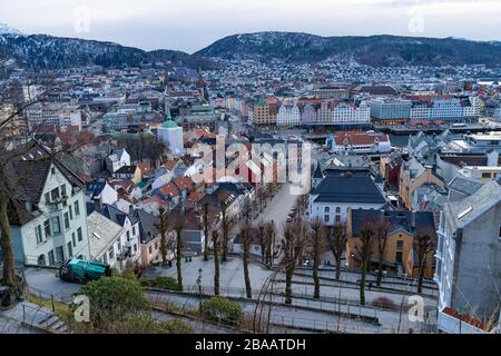 Bergen, Norway. Historic Bergen city center with mountains in the background at sunset. Stock Photo