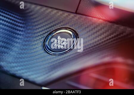 Engine start stop button in modern sport car. Stock Photo