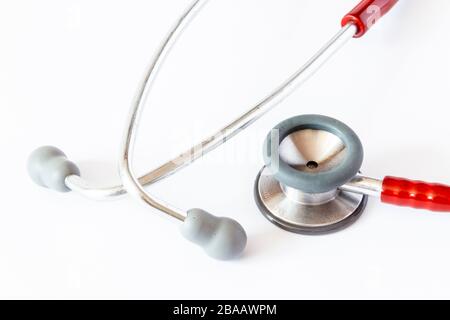 A red stethoscope isolated on a white background Stock Photo