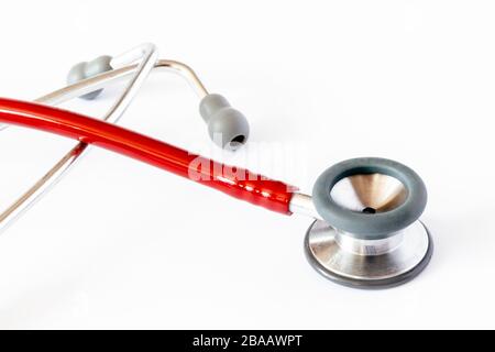 A red stethoscope isolated on a white background Stock Photo