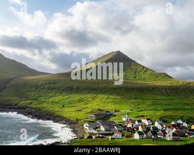Faroe Islands, Eysturoy, Gjogv. View over the town from slopes of mountains surrounding the Gjogv. Panoramic view of this idyllic village.