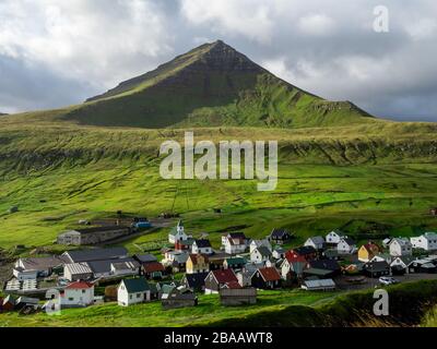 Faroe Islands, Eysturoy, Gjogv. View over the town from slopes of mountains surrounding the Gjogv. Panoramic view of this idyllic village. Stock Photo