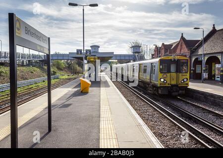 Train from Liverpool arriving at Birkenhead North railway station on the Merseyrail network, Wirral. Stock Photo