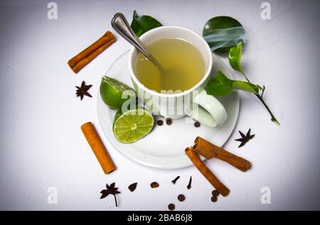 hot lemon tea cup beverage with lemon spices on white table background zenith Stock Photo