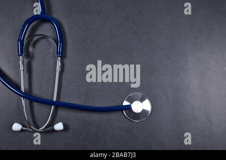 Doctor's stethoscope on black table, stethoscope concept photo with copy space empty area for text Stock Photo