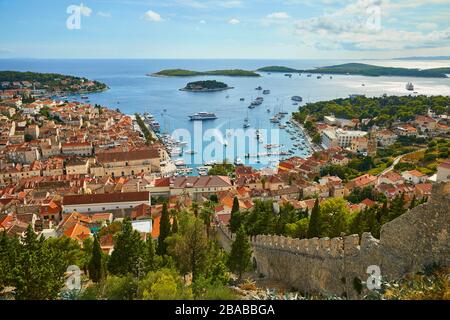 Aerial view of the town of Hvar, Croatia with the yachts in the harbor on a sunny day Stock Photo