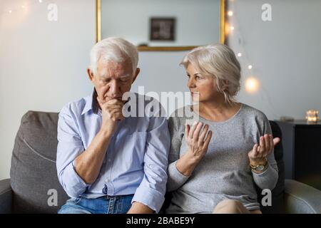 Senior couple having an argument at home Stock Photo