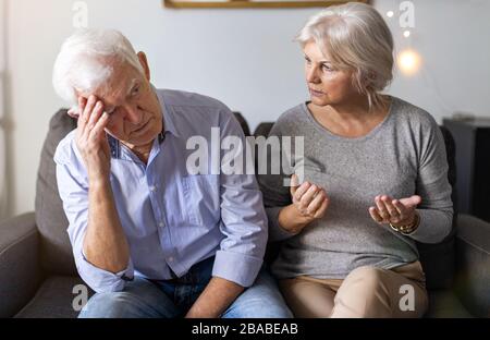Senior couple having an argument at home Stock Photo