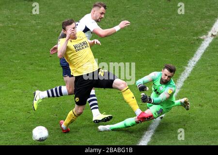 Preston North End goalkeeper Declan Rudd makes a save from Millwall's Jon Dadi Bodvarsson (left) shot on goal Stock Photo