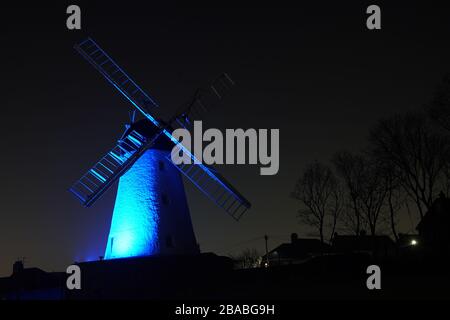 Fulwell Windmill in Sunderland is lit up in blue in a gesture of thanks to the hardworking NHS staff who are trying to battle coronavirus. A national salute for the frontline healthcare heroes is taking place across the UK with a mass round of applause from doorsteps, windows and balconies on Thursday at 8pm. Stock Photo