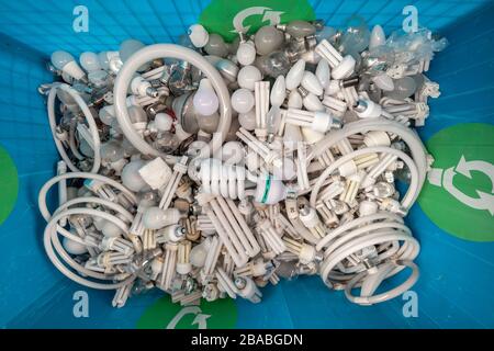 Used and disposed of energy saving lamps in waste transfer station Stock Photo