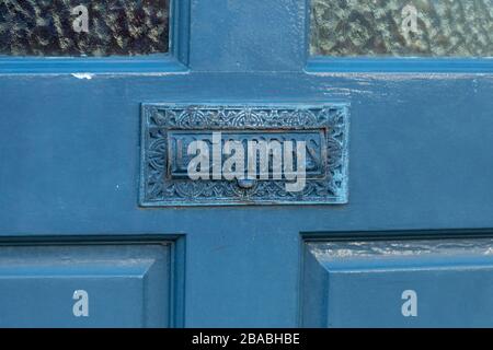 a close up view of a front door with the letter box on the front Stock Photo