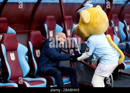 Tottenham Hotspur manager Jose Mourinho with Aston Villa's mascot Bella prior to kick-off Stock Photo