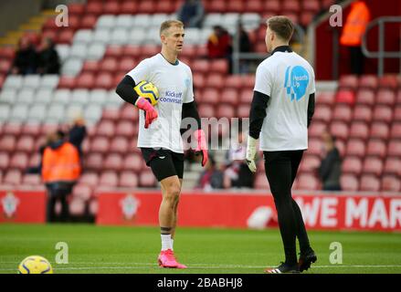 Burnley goalkeeper Joe Hart (left) warming up wearing a Heads Up campaign t-shirt Stock Photo