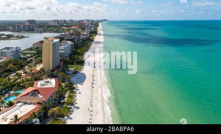 Empty beaches in Naples Florida in the middle of Spring Break and peak season due to Corona Virus Covid - 19. Typically these gulf beaches are full of tourist in the middle of high tourist season. Stock Photo