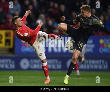 Charlton Athletic's Jake Forster-Caskey and Barnsley's Kilian Ludewig battle for the ball Stock Photo