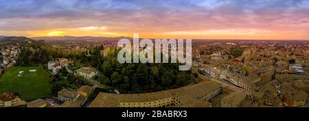 Aerial view of Cesena Italy with the Malatesta Castle dominating the hilltop during sunset Stock Photo