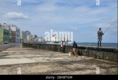 Fishermen along the Malecón in Havana, Cuba Stock Photo