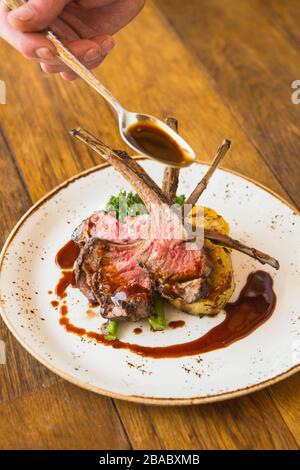 grilled Australian lamb rack with roasted sweet potatoes, charred ...