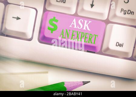 Writing note showing Ask An Expert. Business concept for consult someone who has skill about something or knowledgeable Stock Photo