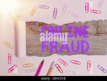 Handwriting text Online Fraud. Conceptual photo use of Internet services to deceive victims and steal money Stock Photo