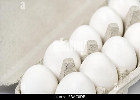 Paper Egg Tray with white eggs. chicken white eggs close up. farm chicken ecologic eggs Stock Photo