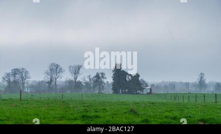 Heavy rain falling over the Normandy countryside in winter Stock Photo