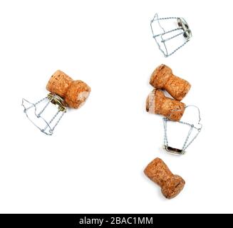 Corks from champagne wine and muselets after party. Isolated on white background. Stock Photo