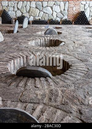 July 6, 2019 - Sekhnika Winery, Kakheti, Georgia - Traditional method of producing Georgian wine in underground clay vessels called qvevri. Stock Photo