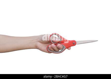 hand holding red scissors isolated on white background with clipping path. Stock Photo