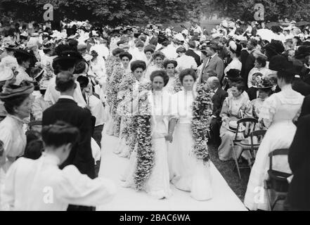 Vassar College graduates enter their graduation ceremony carrying a daisy chain, June 1908. Vassar was founded as the first American degree-granting institution of higher education for women in 1861  (BSLOC 2018 2 66)