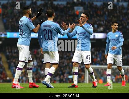 Manchester City's Bernardo Silva (centre) celebrates scoring his side's second goal of the game with team-mates Riyad Mahrez (left) and Phil Foden