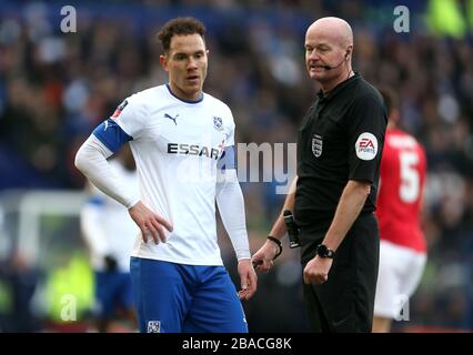 Referee Lee Mason (right) speaks with Tranmere Rovers' Kieron Morris Stock Photo