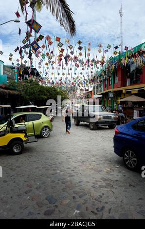 Street and daily life on a high tourism season day in Central Sayulita, Nayarit, Mexico. Stock Photo