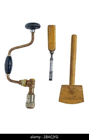 old hand drill, chisel and old wooden mallet.  Isolated on a white background Stock Photo